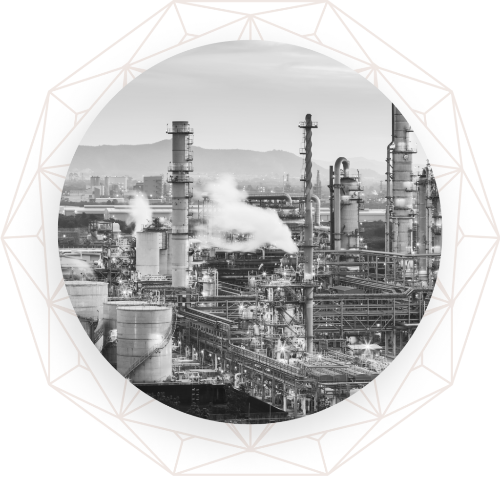 Wide shot of a refinery, emitting exhaust